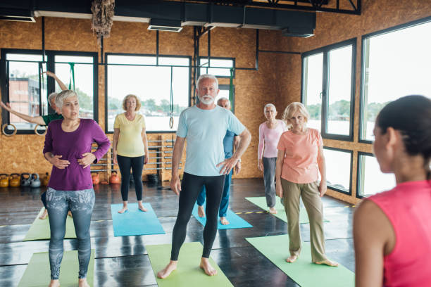 istock Senior taking a rest between exercises on the yoga class 1193556282