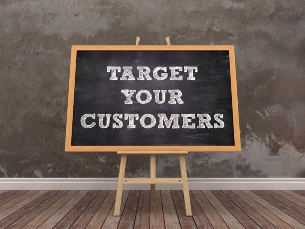 istock Easel with TARGET YOUR CUSTOMERS Phrase in Room - 3D Rendering 1193560020