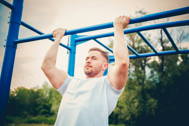 istock Man doing gymnastic on the bar 1193561488