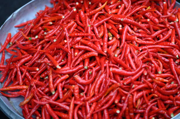 Image of Fresh red hot chili peppers on market.