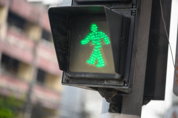 Green light signal for pedestrians to pass intersection.
