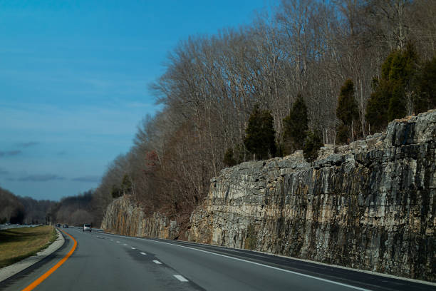 Rocky Slate Walls Line the Highways of Kentucky as Trees Cling to the Sparse Soil.