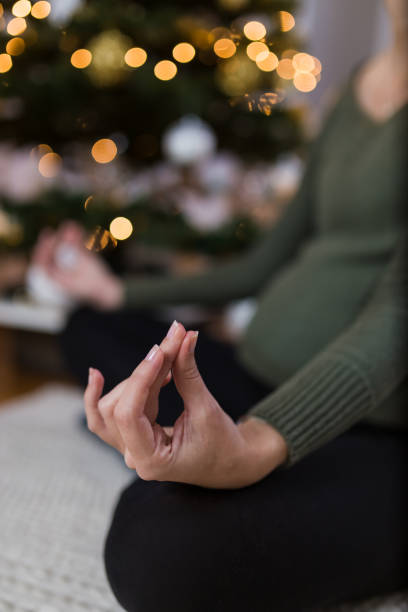 istock Practicing yoga during pregnancy. Christmas holiday and exercising concepts. 1193566308