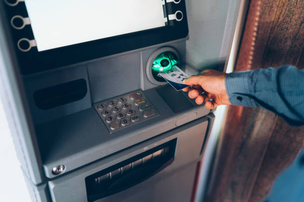 istock Man inserting credit card in the ATM 1193567868