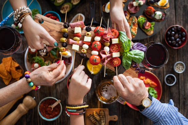 istock Offering and serving tapas to many people hands 1193568534