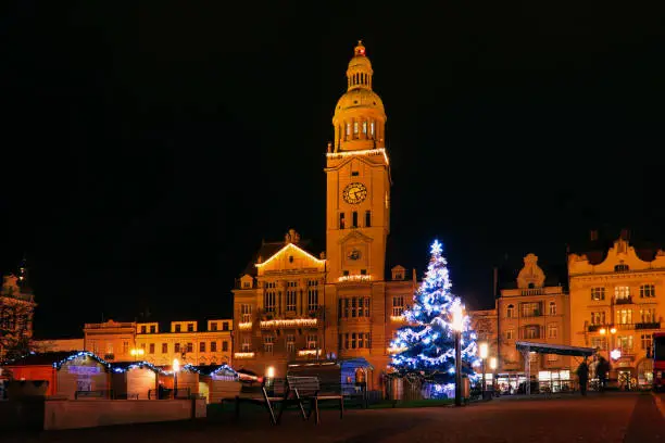 Clock tower and Christmas tree on Prostejov square in the Czech Republic in the dark
