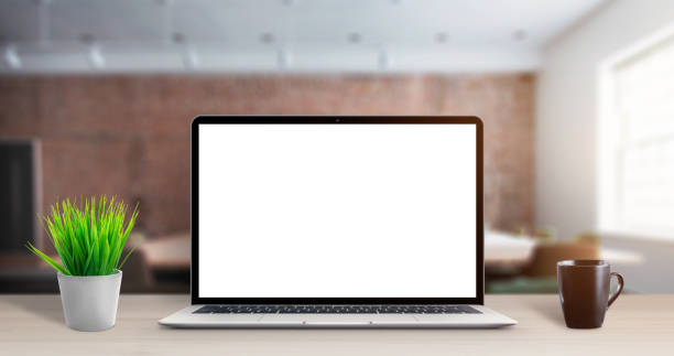 istock Laptop computer mockup on office desk. Modern, thin laptop with isolated in white, blank screen for app or web site promotion 1193570277