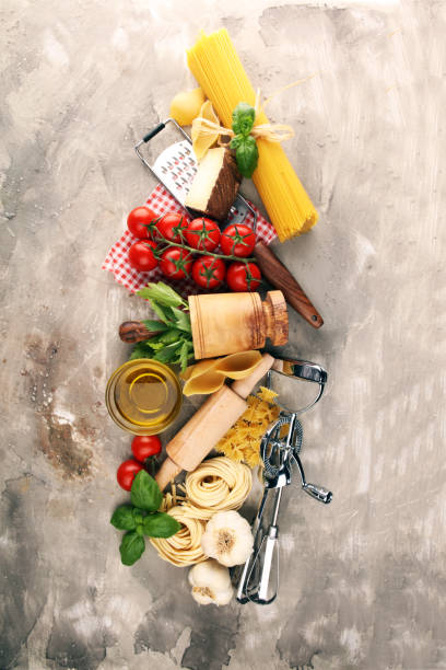 istock Pasta, vegetables, herbs and spices for Italian food on rustic table 1193571062