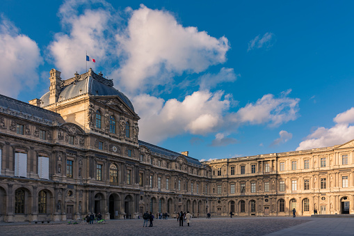 Paris, France - November 7, 2019: Entrance from the Square Courtyard (Cour Carrée) to the Pyramid Courtyard, in the Louvre museum