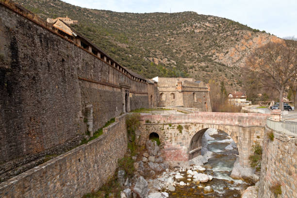 Fortified village of Villefranche-de-Conflent in the Pyrenees-Orientales Fortified walls of the village of Villefranche-de-Conflent in the department of Pyrénées-Orientales, in the region of Occitanie. villefranche de conflent stock pictures, royalty-free photos & images