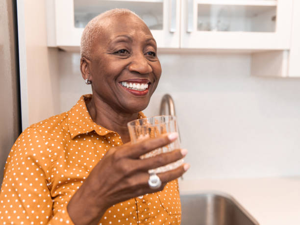 istock Enjoying Her Glass of Water 1193572254