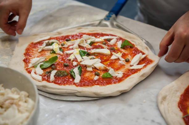 istock Preparing Pizza dought at the pizzeria. 1193572385