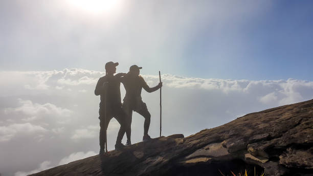 istock Bajawa - A couple walking above the clouds 1193572393