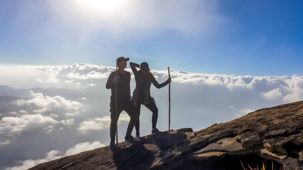 istock Bajawa - A couple walking above the clouds 1193572490