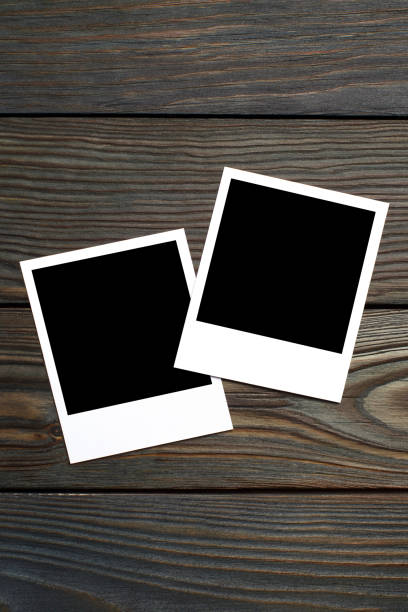 istock Two blank photocards on wood 1193572732