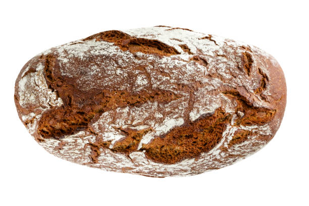 istock Rye bread with dark crust. Top view of rye bread loaf isolted on white background 1193572740