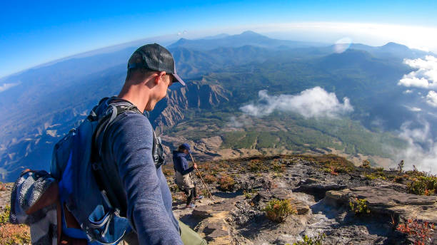 istock Bajawa - A couple dowing down the volcano Inierie 1193572851