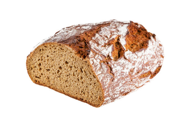 istock Closeup of rye bread halved isolated on white background 1193573552
