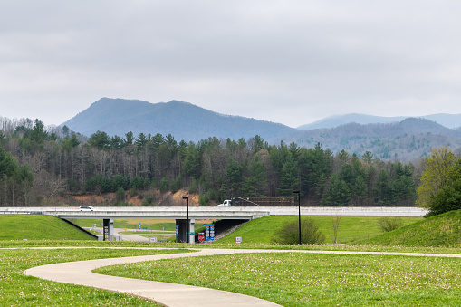Walnut Hill, USA - April 19, 2018: Tennessee North Carolina border rest area stop with view of highway and smoky mountains in spring