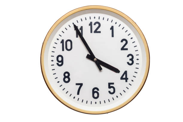 istock Wall clock isolated on the white background. Simple classic round wall clock isolated on white. 1193576333