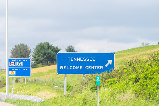 Bristol, USA - April 19, 2018: Welcome Center exit and gas station sign on highway in Virginia on interstate 381 and Tennessee text