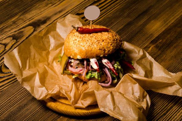 istock Bacon burger with on wooden table 1193577642