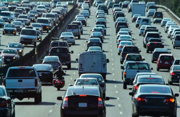 Crowded vehicle traffic and the only motorcycle in America stock photo
