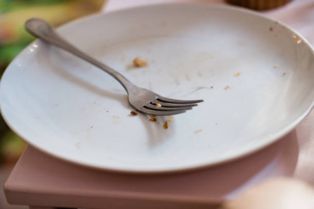 istock Dirty fork on eaten off plate 1193582110