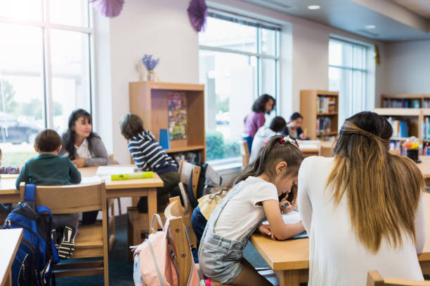 istock Group of students in school library 1193583643