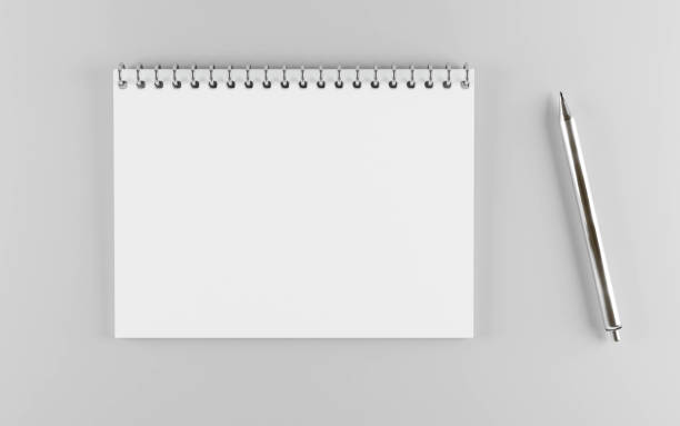 istock empty horizontal white paper spiral notebook with a metal pen 3d render illustration 1193584548