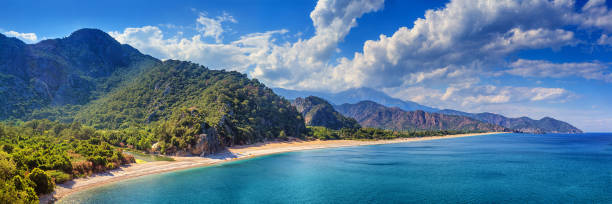 Summer mediterranean coastal landscape - view of the Cirali Olympos Beach Summer mediterranean coastal landscape - view of the Cirali Olympos Beach, near the Turkish village of Cral, Antalya Province in Turkey cirali stock pictures, royalty-free photos & images