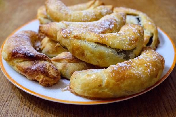 istock Baked sweet bun sprinkled with sugar. 1193592476
