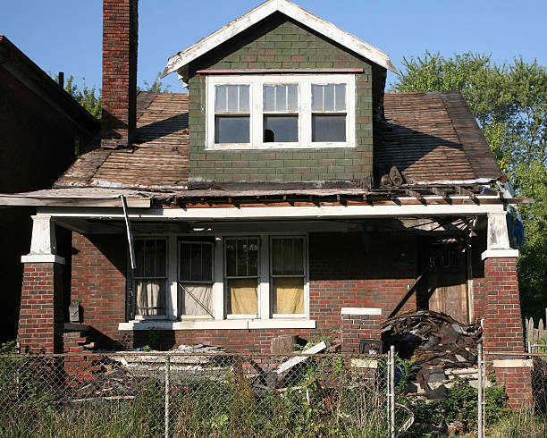 House caving in and rotting after being abandoned stock photo