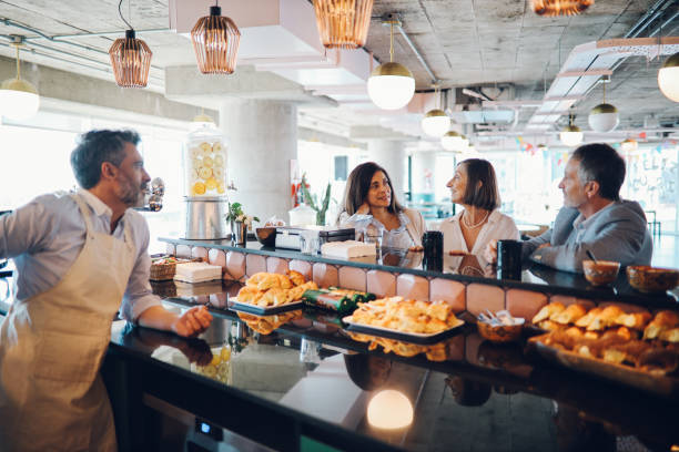 istock Friends talking in the cafeteria 1193601933