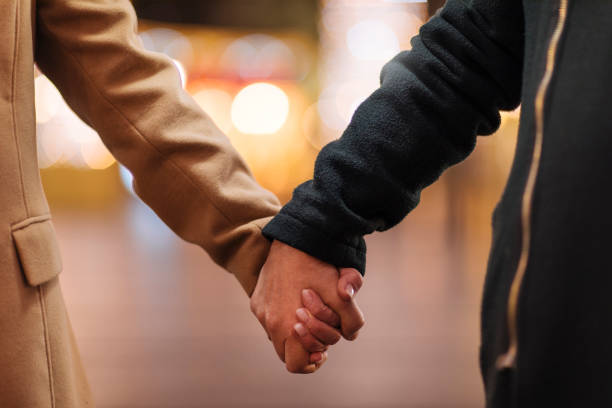 istock Elderly couple holding hands 1193602581