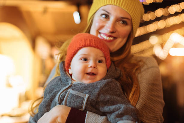 istock Mother holding her baby 1193602628
