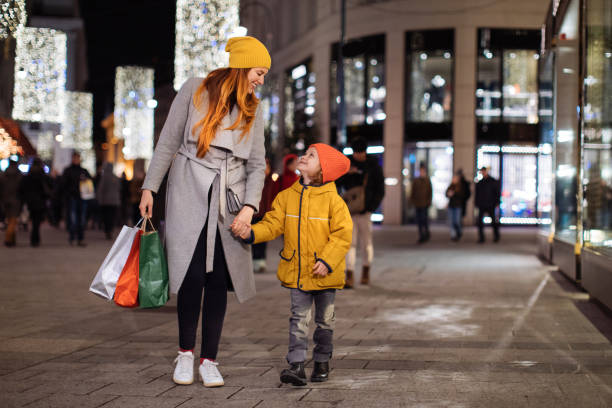 istock Mother and boy walking and shopping 1193602629