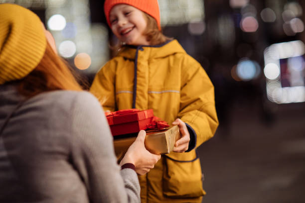 istock Boy giving a gift to his mother 1193602638