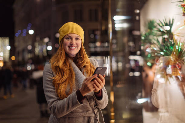 istock Lady standing in front of the store window 1193602683