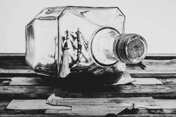 Sailing ship in a bottle, resting on an antique trunk