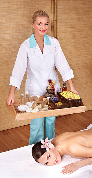 istock Young woman on massage table in beauty spa. Series. 119360655