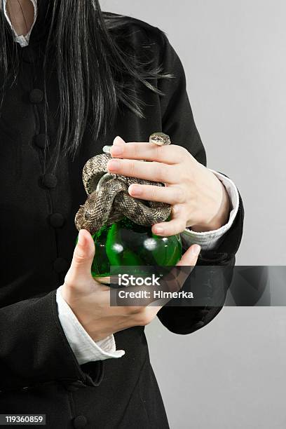 The Person Hold Poison With A Snake Stock Photo - Download Image Now - Buying, Herbal Medicine, Absinthe