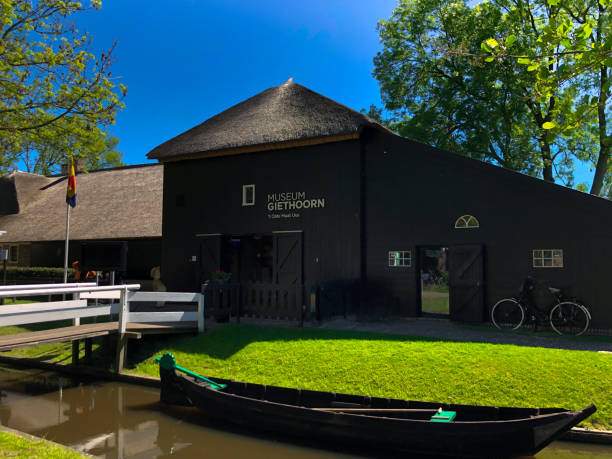 View of old-style houses with detached gardens in Giethoorn, Netherlands. Giethoorn / Netherlands May 5, 2019