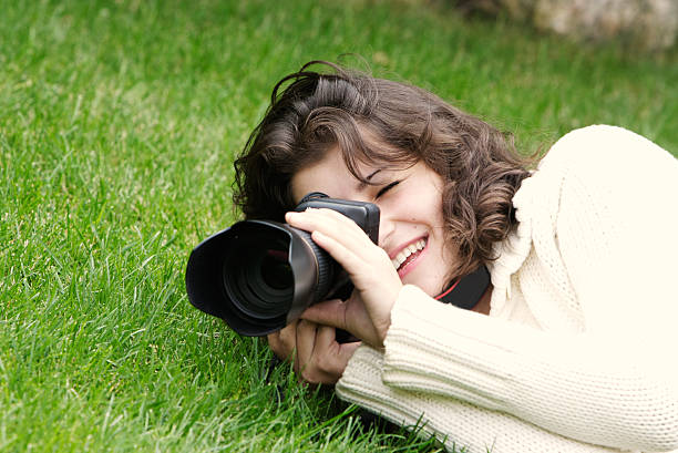 istock young girl taking picture on natural background 119361203