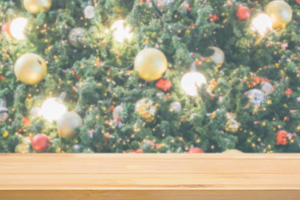 istock Empty wood table top with Abstract blur Christmas tree with decoration bokeh light background for product display 1193614170