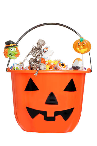 istock halloween pumpkin pail filled with candy 119361546
