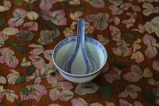 Small white spoons on a white tablecloth