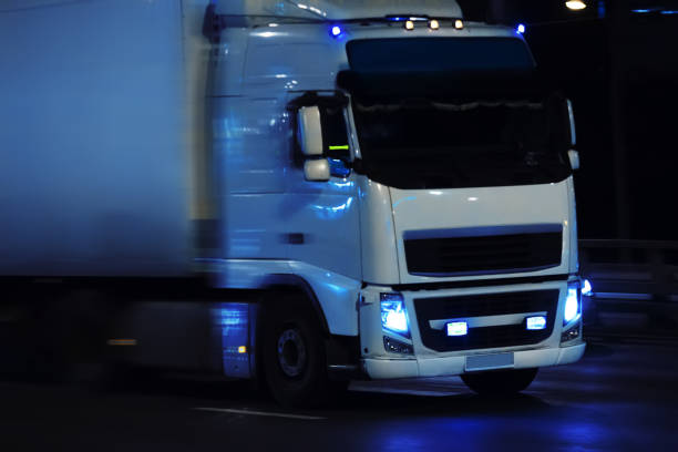 istock truck moving on night city 1193619851