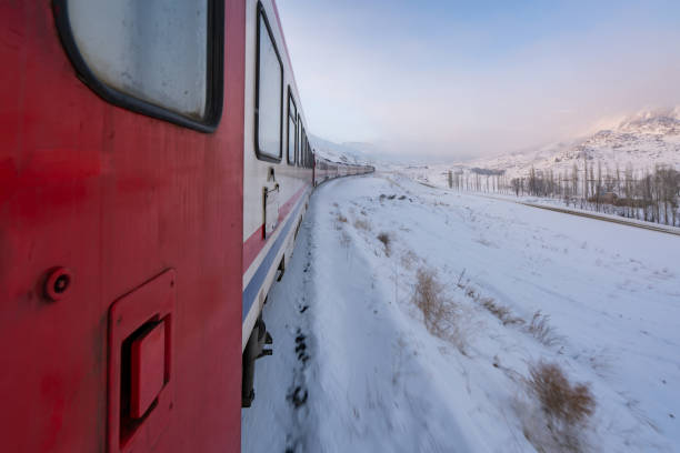 istock train moving on snowy railway track 1193620041