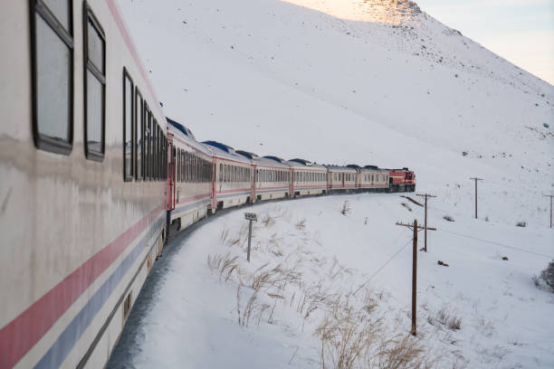 istock train moving on snowy railway track 1193620080